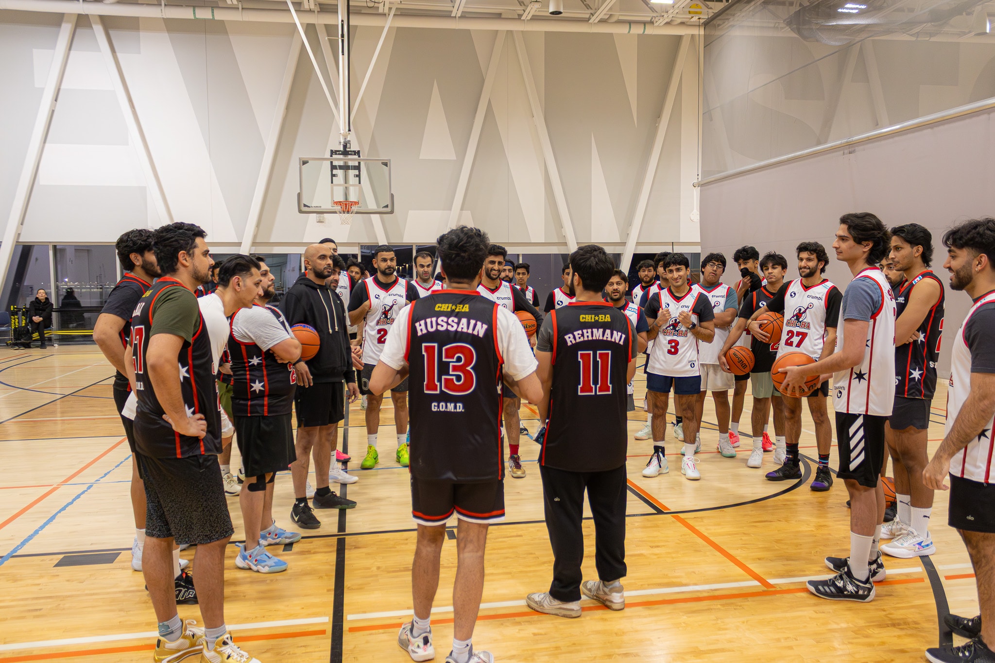 League meeting basketball team on court