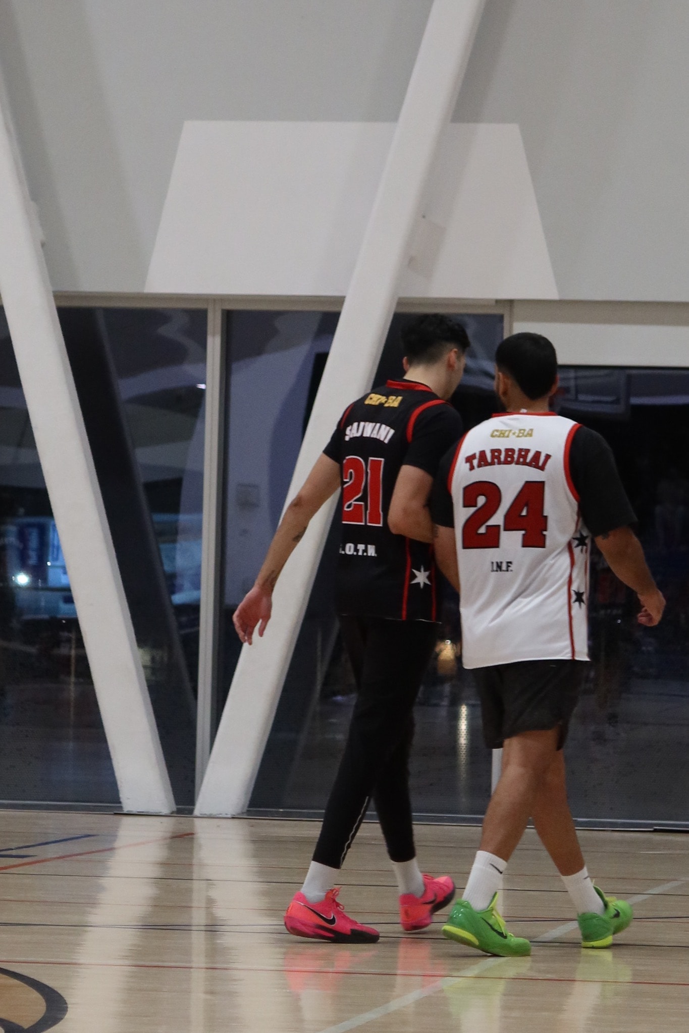 Basketball players walking on court